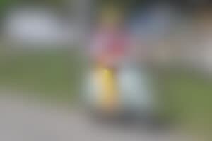 smiling clown on motorcycle